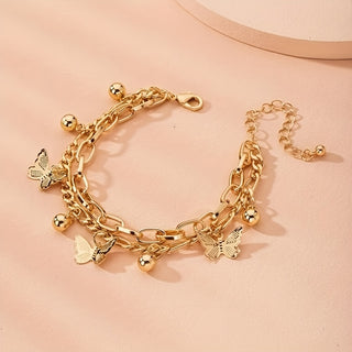 Elegantes Doppelarmband-Set mit Schmetterlingsanhänger in Goldoptik